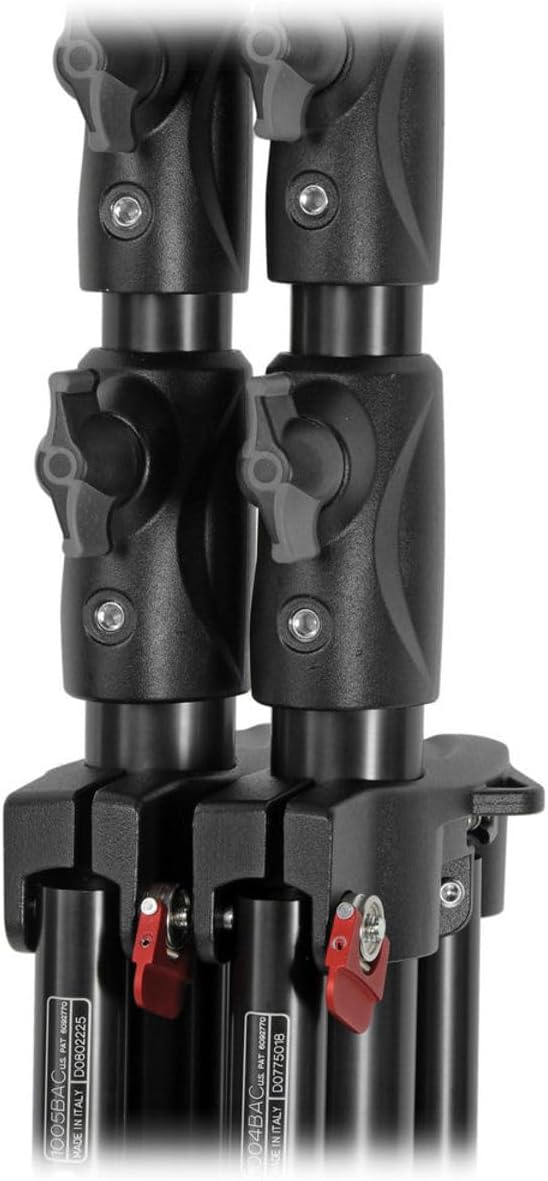 Close-up of a black tripod with adjustable legs on a white background