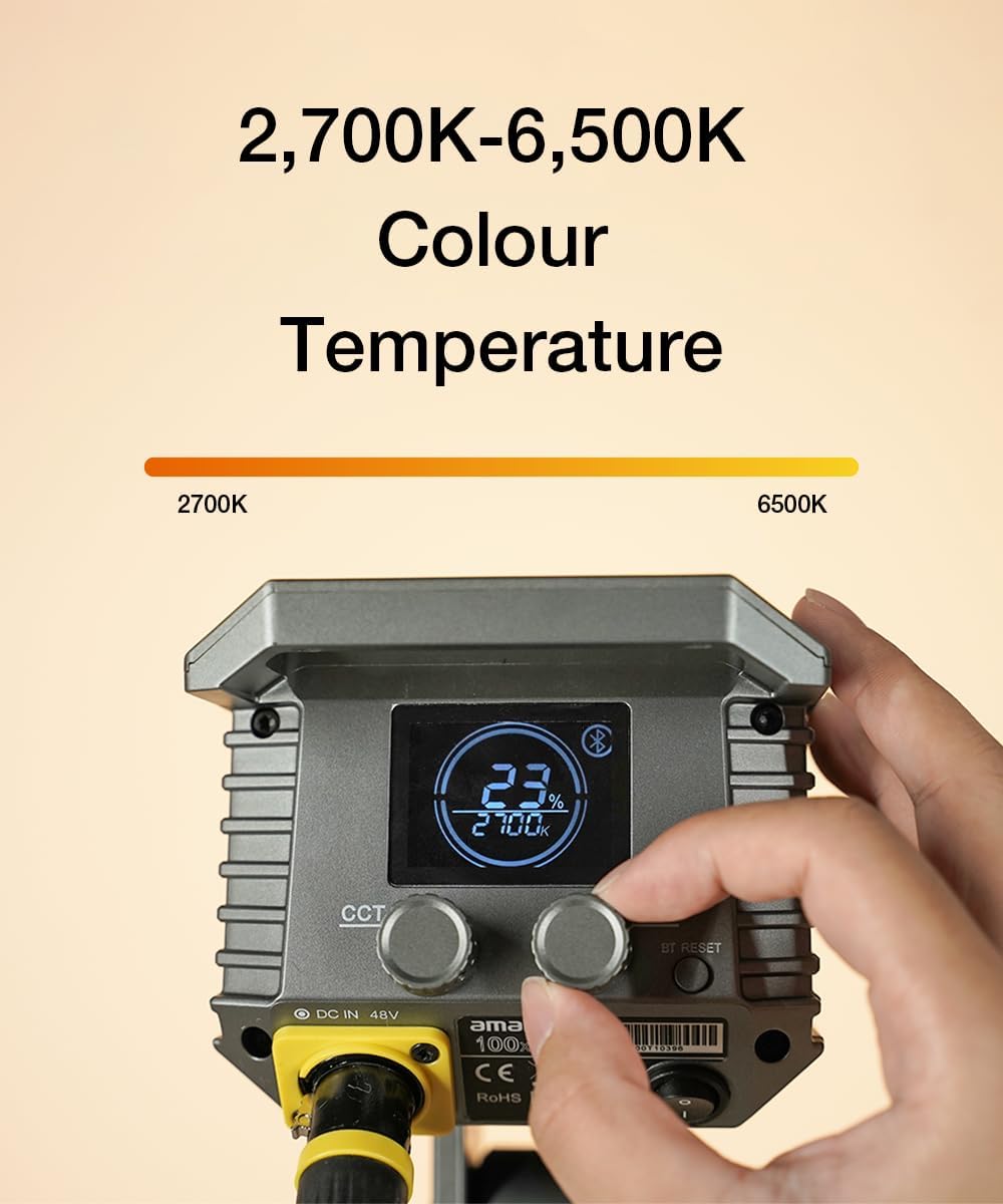 Color temperature control device with digital display and hand adjusting it on a beige background