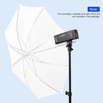 White photography umbrella with a light stand and monolight on a light blue background