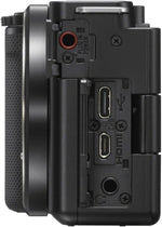 Back view of a black camera body with ports and connectors on a white background