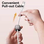 Hand holding a cable with a pull-out feature on a light pink background