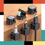 Set of various black cable connectors on a wooden surface