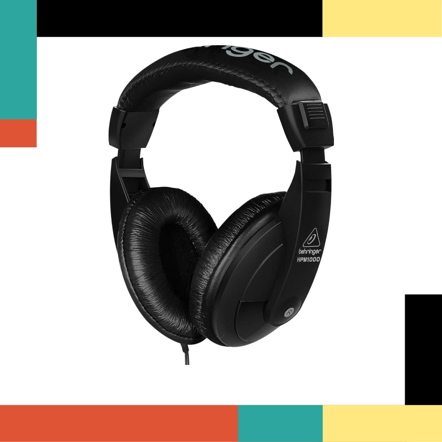 Black headphones with 'Behringer' branding on a colorful geometric background