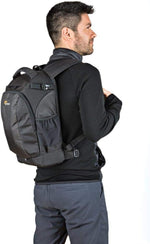 Man wearing a gray backpack on a white background