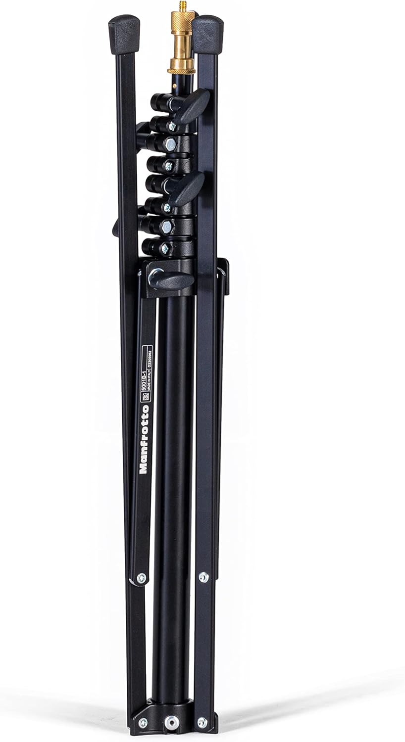 Black metal tripod with adjustable legs on a white background