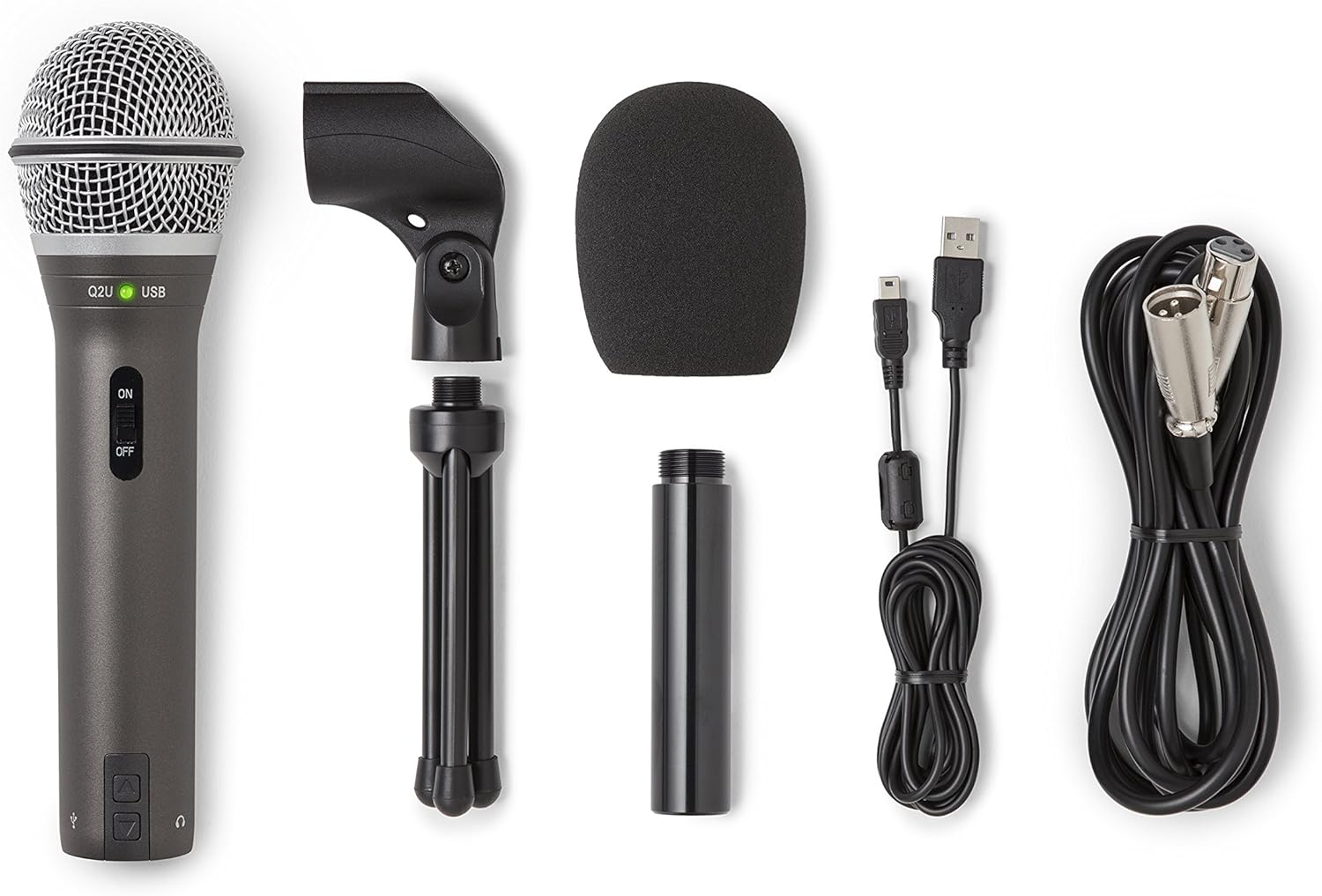Set of audio equipment including a microphone, stand, and cables on a white background