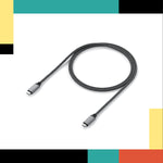 Coiled black cable on a white background with colorful bars at the top and bottom.