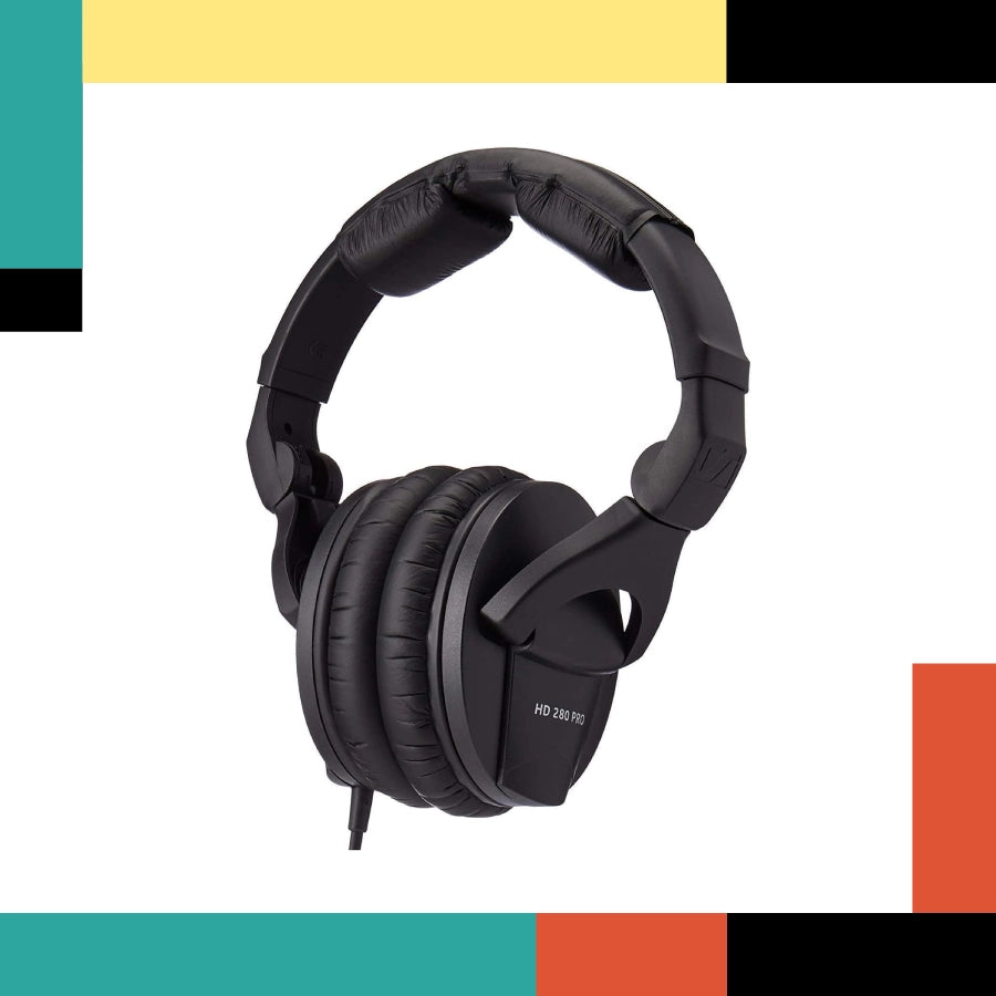 Black headphones on a white background with colorful geometric shapes