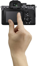 Hand interacting with a camera on a white background