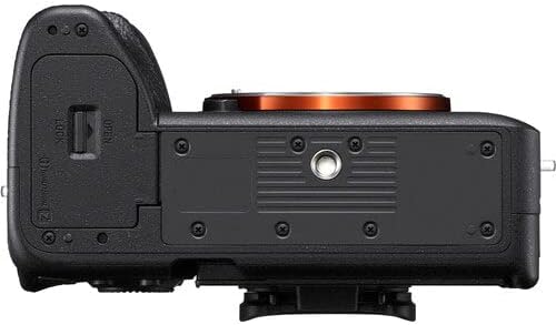 Back view of a camera body with battery grip on a white background